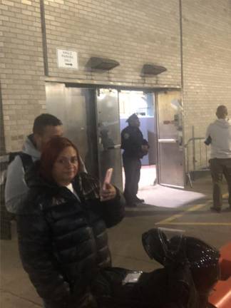 <b>Immigrants begin arriving at former NYPD Academy on Friday May 5 and men and women were spotted, although Straus News did not see any children on the scene.</b> Photo: Keith J. Kelly