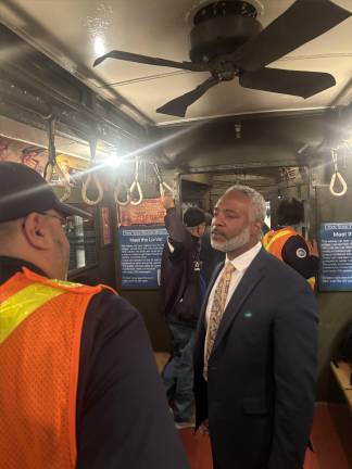 NYC Transit president Demetrius Crichlow chats with MTA workers after boarding the Yankee Express notalgia train at Bowling Green.