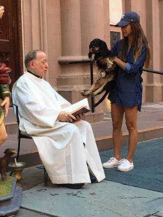 The Rev. Monsignor Donald Sakano at the Blessing of the Dogs. Photo: Estelle Pyper.