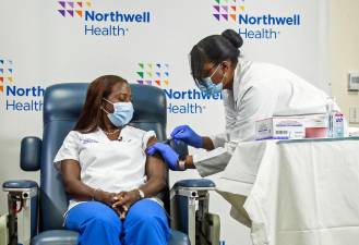 Sandra Lindsay, an intensive care nurse at <a rel=nofollow noopener noreferrer href=https://lij.northwell.edu/ target=_blank>Long Island Jewish Medical Center</a>, was one of the first in the nation to raise her hand to take the BioNTech/Pfizer mRNA <a rel=nofollow href=https://www.northwell.edu/coronavirus-covid-19>COVID-19</a> vaccine, delivered by Michelle Chester, DNP.