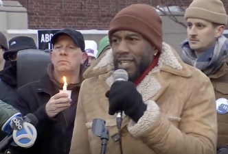Public advocate Jumaane Williams speaks at a frigid candlelight vigil for Alex Pretti and Renee Good outside the VA Hospital on E. 23rd St. on Jan. 29. Community activist Kevin O’Keefe is seen to his left holding candle.