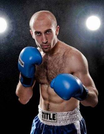 Valentine Lyashenko is a boxer, and also a trainer, coach, massage therapist, and jujitsu and mixed martial arts fighter. Of late, he's lent his expertise to a theater performer. Photo: Masataka Suemitsu