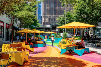 A new plaza has opened next to Spring Street Park in Hudson Square, complete with furniture and a vibrant mural. Free programming will be held at the park until October 29.