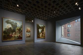 Room 24: Four grand panels of Fragonard’s series “The Progress of Love” are shown together at Frick Madison in a gallery illuminated by one of Marcel Breuer’s trapezoidal windows. This view shows two of the 1771–72 paintings, with two later overdoors visible in the next gallery. Photo: Joe Coscia