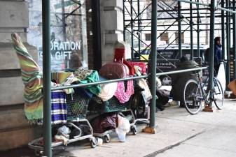 Scaffolding provides some shelter for the homeless at the corner of Broadway and 73rd St.