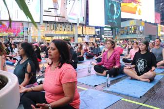 Instructor Colleen Saidman-Yee asked the hundreds of participants to “dedicate this next hour...in a way that will increase peace.” Photo: Zoey Lyttle