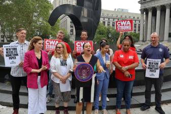 Announcing the “Too Tough To Die” resolution at Foley Square, in front of the Lorenzo Pace sculpture “The Triumph of the Human Spirit.”
