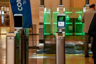 <b>The MTA wants to begin installing a new class of turnstiles with sliding panels that it hopes will defeat the turnstile jumpers on subways who cost the MTA $285 million last year. </b>Photo: Marc A. Hermann/MTA