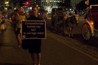 A candlelight vigil was held last week to protest Mayor de Blasio's failure to ban horse-drawn carriages. Photo: Mary Culpepper