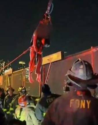 Injured teen after being hoisted by firefighters from a 50 shaft on the Queensboro Bridge on Feb. 16. “Friends,” who thought he was dead, never called authorities.