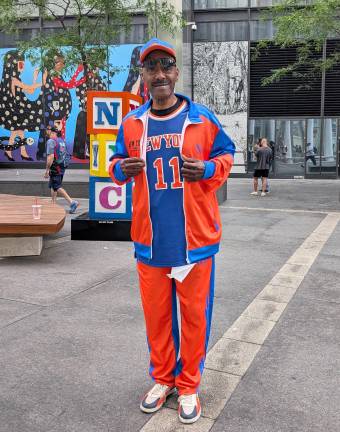 Knicks parade attendee in orange and blue. This is “Outfit Architecture” as Dallas Penn would say.