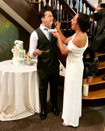 Wedding cake, groom and bride on June 11. Photo courtesy of Laura Santos-Bishop