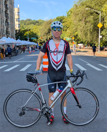 A Manhattan Summer Streets bicylist who started at Centre Street poses in Inwood.
