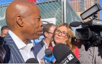 <b>Eric Adams speaks with reporters addressing the sexual assault law suit that has been filed against him. He denies the claims.</b> Photo: Twitter