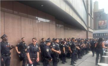 Cops, such as the those above during the Knicks championship finals, have been facing mandatory overtime during a summer of Knicks, Taylor Swift, FIFA World Cup and America’s 250 birthday. The PBA is blasting the Mamdani Administration for delaying checks for overtime pay.