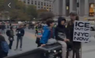 Handpainted sign demands “ICE Out of NYC” in a demonstration in Foley Square the day after migrants were detained along Chinatown’s Canal Street, setting up angry clashes between ICE agents and protesters..