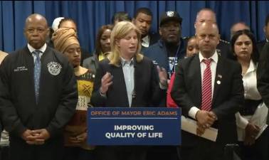NYPD Commissioner Jessica Tisch (center) and NYC Mayor Eric Adams (left) unveiled the Quality of Life division during an April 10 kickoff at the 13th Precinct on the East Side. Francisco Marte (front row right), president of the Bodega and Small Business Group ,praised the new pilot program.