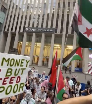 Pro-Palestinian protestors outside the News Corporation building, 1211 6th Avenue, Oct. 7, 2025.