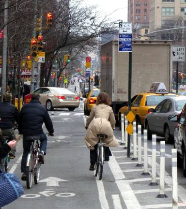 Cyclists heading southbound on Ninth Avenue near West 30th Street. Photo via Wikimedia Commons