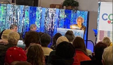 Gianni Perilli, author of “<i>Community Geriatric Care,” </i>addresses a packed house<i> </i>at the rectory of St. Thomas Moore parish on Dec. 10. She outlined ways that faith-based organizations and other community groups can play a vital role in caring for adults suffering from dementia.