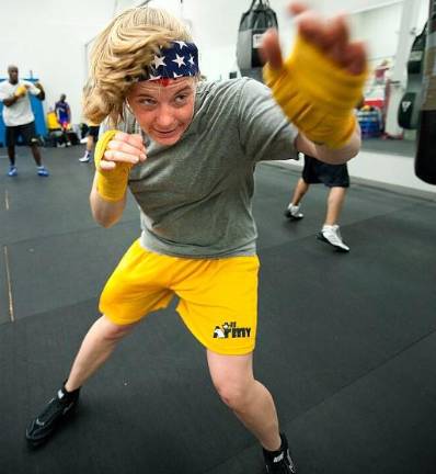 Shadow boxing can be incorporated into other routines indoors that together can simulate the effects of running a mile outdoors. U.S. Army Capt. Rachell Wehrle shadow boxes during her workout at the gym on Lackland Air Force Base, TX, Feb. 15, 2011.