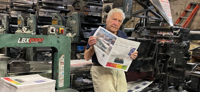George Capsis looking over the June 2021 Politics and Pride issue. Photo: Dusty Berke