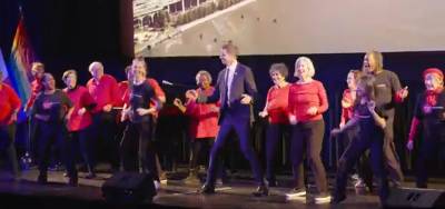 New York State Senator Erik Bottcher busting a move with a troupe from Dances for a Variable Population, at his inauguration ceremony at the American Musuem of Natural History.
