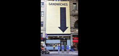 Quirky Karen sleuths in sandwich camouflage.