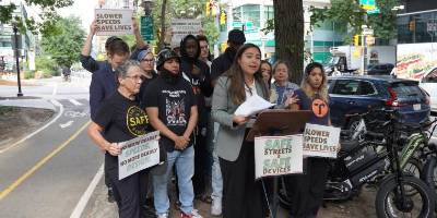 This photos shows Senator Gonzales campaigning for the passage of bill S10700 for safer streets and vehicles.