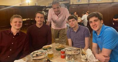 The Ferrari family at a Father’s Day celebration at Peter Luger Steak House in 2021, with Robert Ferrari (center) surrounded by his four sons (from left) Kevin, Matthew, Brian, and Peter.