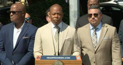 Mayor Eric Adams and NYPD Commissioner Edward Caban (in the matching tan suits) at a September 6th press conference, where they proclaimed their desire to eliminate car thefts via police tech and PSA campaigns.
