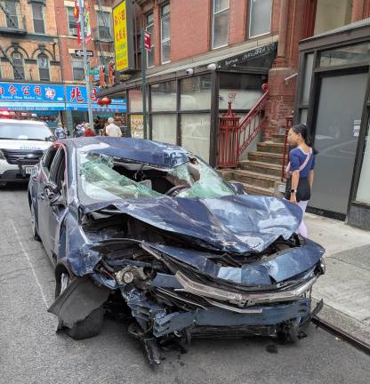 The stolen Chevy Malibu death car parked on Elizabeth Street, outside NYPD Fifth Precinct, July 19.
