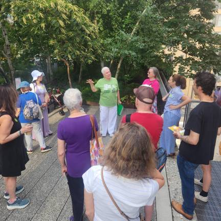 A docent leads a group of visitors on a tour of the High Line earlier this summer.