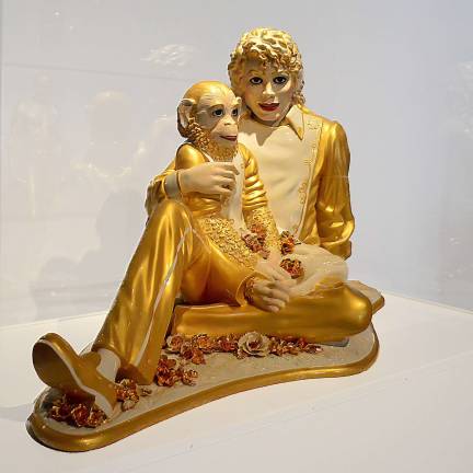 Jeff Koons combines high and low while reflecting on the opulence of porcelain in his "Michael Jackson and Bubbles" from 1998. Photo: Adel Gorgy
