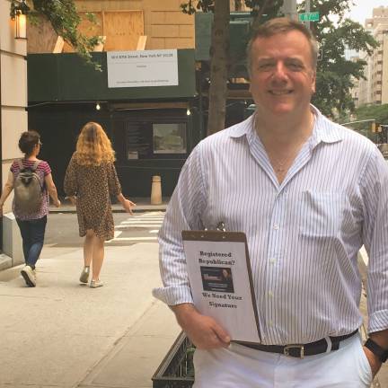 Born-again Republican Pete Holmberg, a former Democrat, collects signatures at the corner of Madison Avenue and 87th Street in his long-shot bid to topple East Side Democratic state Senator Liz Krueger in the Nov. 6 general election.Photo: Courtesy of Holmberg for New York