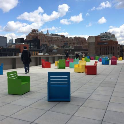 Artist Mary Heilmann&#x2019;s site-specific outdoor installation &#x201c;Sunset&#x201d; on the building&#x2019;s fifth floor outdoor gallery includes colorful chairs and wall hangings that reference the geometric qualities of the museum.