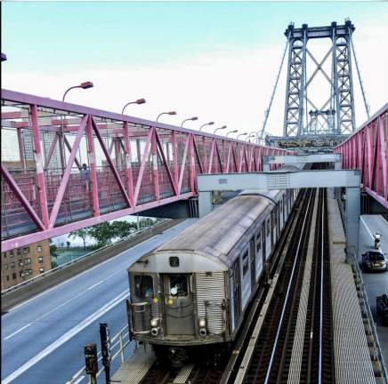 Heading across the Manhattan Bridge towards its Manhattan destination, a Z train of R32s is pictured here, 56 years after the fleet entered service. Full retirement was still two years away.