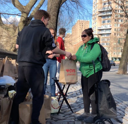 Distributing supplies. Photo via sustainablestartny.org