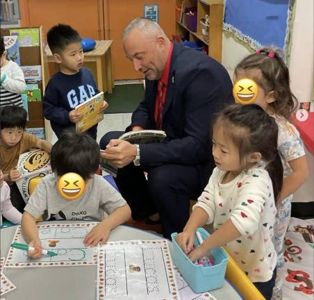 Transfiguration Principal, Mr. Mille, stopping by the 3K class.