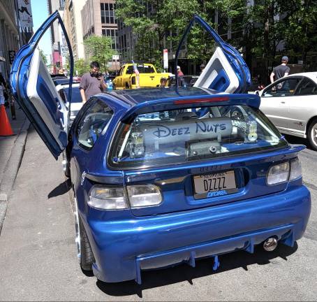 At the AAPI, ca car called “Deez Nuts” with custom New York license plate, DZZZZ.