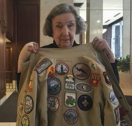 Irma Cohen, 90, shows off a jacket covered in the patches she’s collected while crisscrossing the globe. Photo: Megan Conn