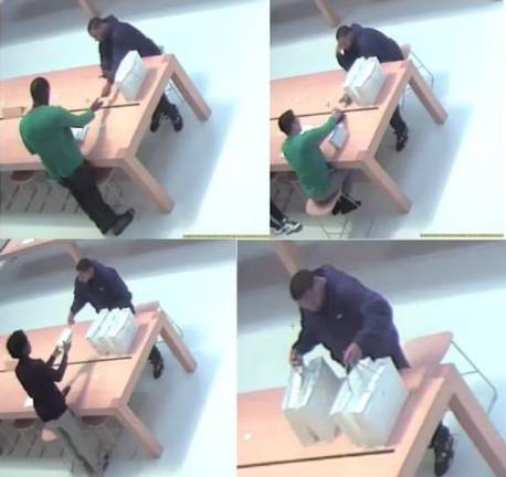 Photo which prosecutors in the Manhattan DA’s office said show members of the “Grinchsters” using stolen credit cards to purchase products at the Apple flagship store on Fifth Ave.