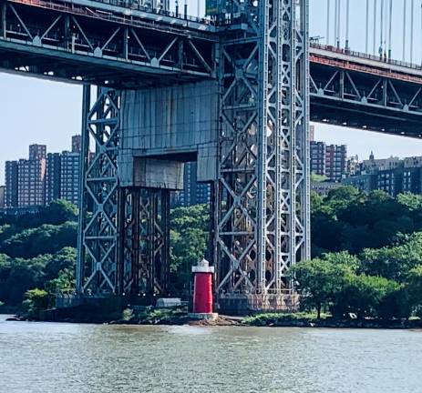 The George Washington Bridge, along with the Outerbridge Crossing in Staten Island, are the two Port Authority Bridges that have come under the microscope of the NTSB for not having had an adequate risk assessment done. Here, under the giant Manhattan Tower that supports the suspension cables lies the Little Red Light House of children’s book fame, tucked away on the shoreline.
