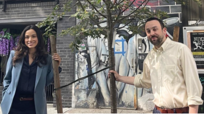 Councilmembers Rivera and Keith Powers pose with the 1,000th tree planted as part of the East Side Coastal Resiliency Project.