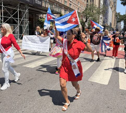 Cuban Day Parade brings multitudes including “Presidenta” Barbara Cabon (right).