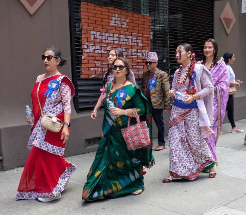 Celebrants on Madison Avenue make their way to the parade start.
