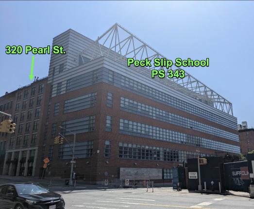 Former Hampton Inn at 320 Pearl Street next to Peck Slip School, P.S. 343.