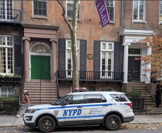 NYPD 5th Precinct patrol car outside NYU Guarini Institue for Global Legal Studies.