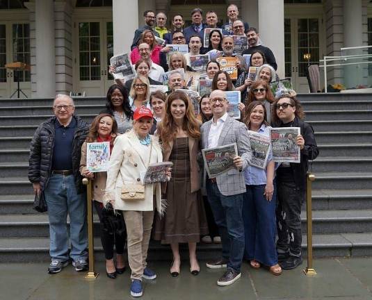 City Council speaker Julie Menin (first row center) hosted journalists seeking to unionize Schneps Media at a rally at City Hall as the unionization drive kicked off earlier this year.