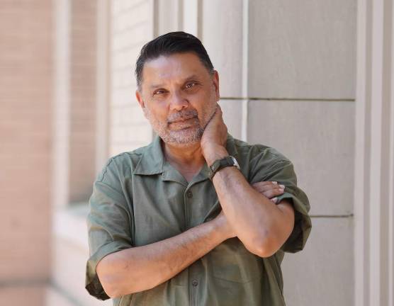 Author Amin Ahmad teaches creative writing at Duke University. He immigrated to America from India in 1985 at age 17 and drew from his own family secrets, former career as an architect, and love of “The Great Gatsby<i>”</i> to create his debut novel, “A Killer in the Family.”